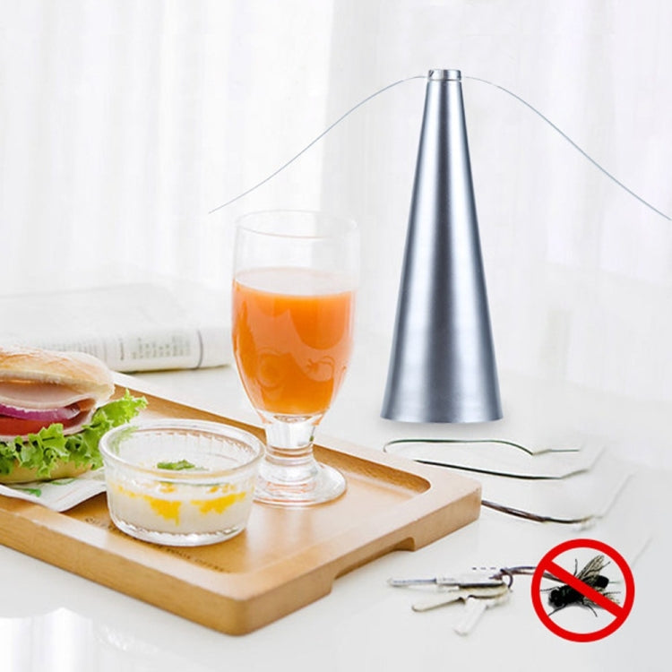 Silver cone fan on tabletop with no-insect symbol
