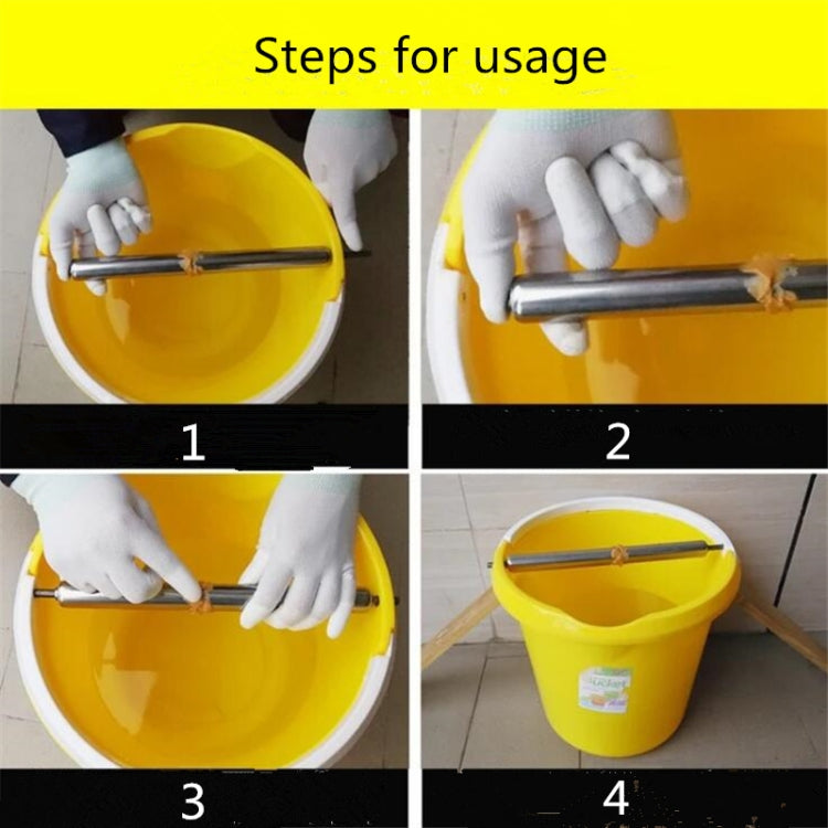 Gloved hands installing an automatic continuous mousetrap into a yellow bucket