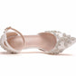 Side view of white rhinestone pointed-toe stiletto heels with ankle strap