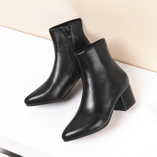 Women’s black ankle boots with pointed toe, block heel, and side zipper—pair view