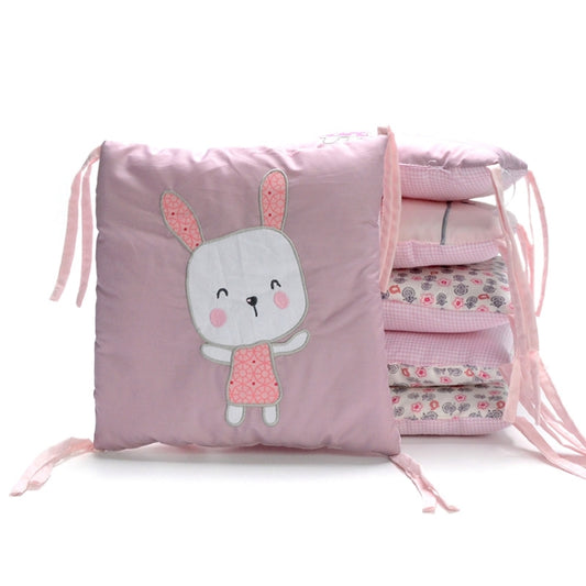 Pink square bumper pad with embroidered bunny face and ribbon ties
