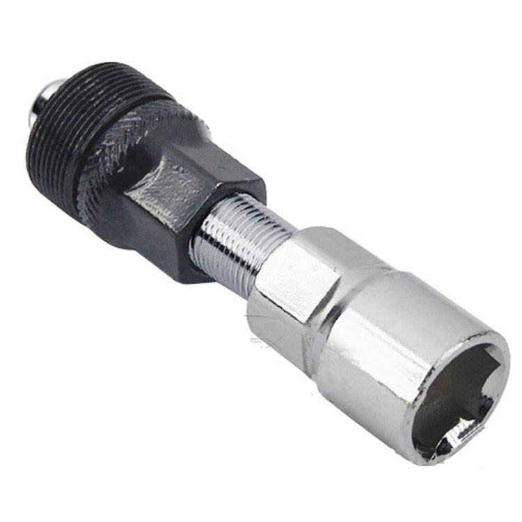 Bicycle bottom bracket tool close-up: chrome socket, threaded section, black housing
