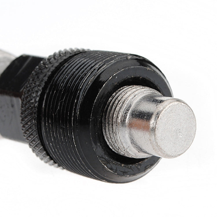 Bicycle bottom bracket tool close-up of black threaded collar and silver insert