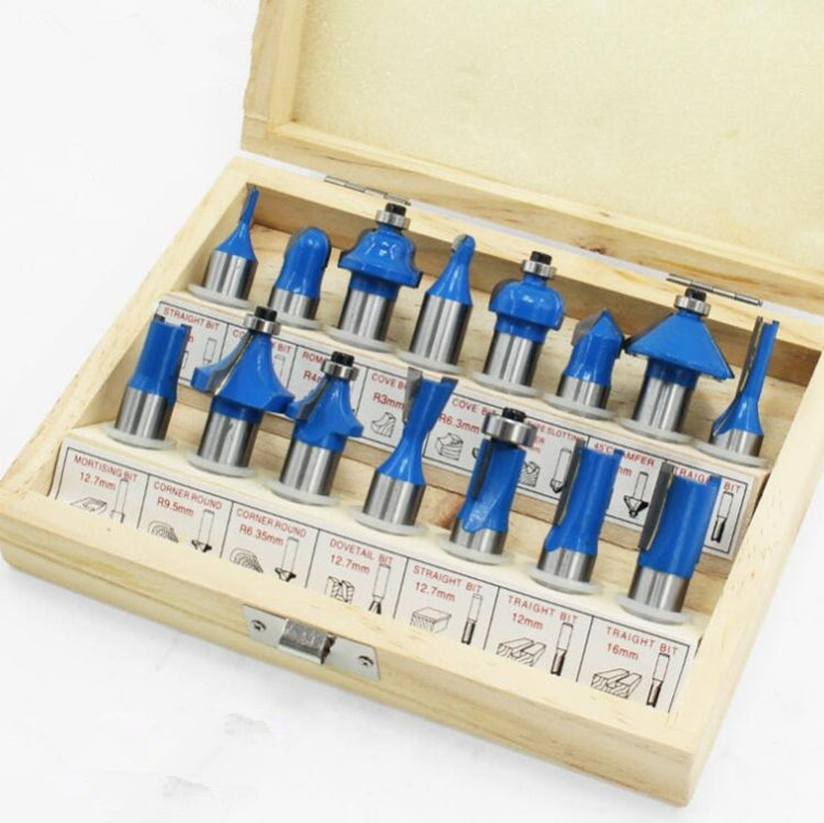 Woodworking milling cutter set close-up with blue-handled router bits in tray