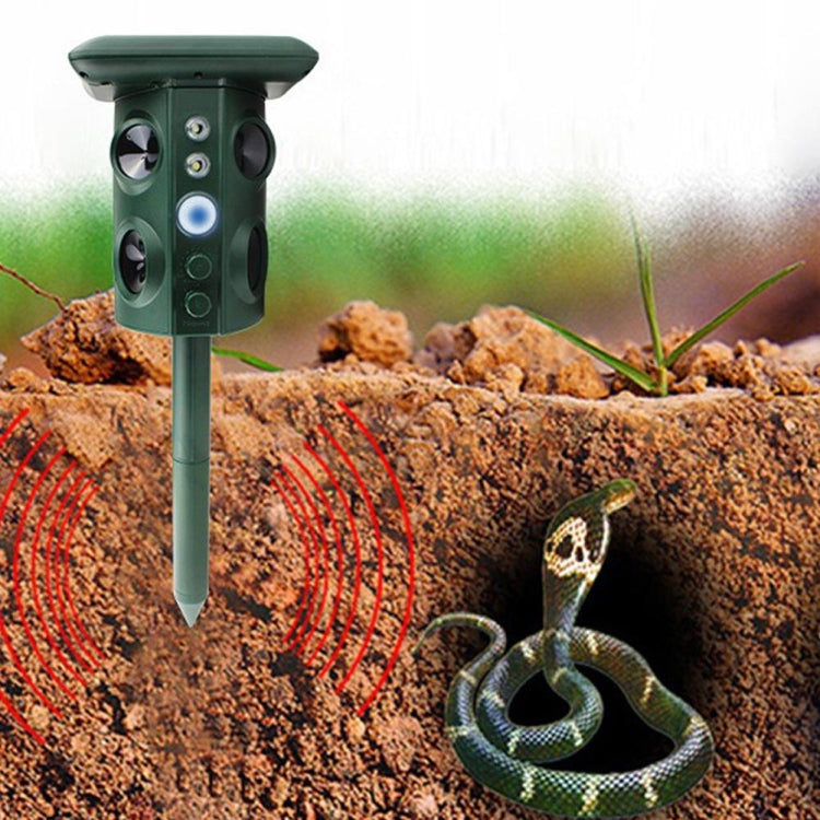 Green solar ultrasonic repeller with stake, shown emitting sound waves toward a snake