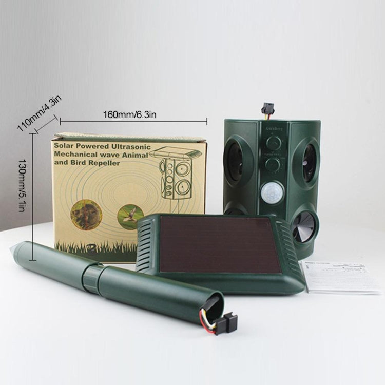 Green solar ultrasonic animal repeller with stake and solar panel, plus instruction materials