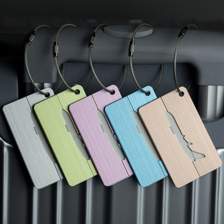 Set of brush aluminum luggage tags in green, purple, blue, and tan with airplane cutouts