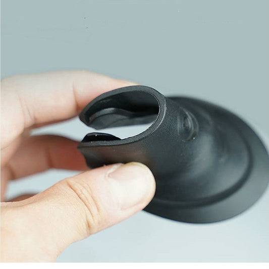 Black fishtail rubber fender held in hand, curved with center opening