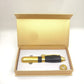 Gold and black needleless beauty injector pen in an open gold storage case