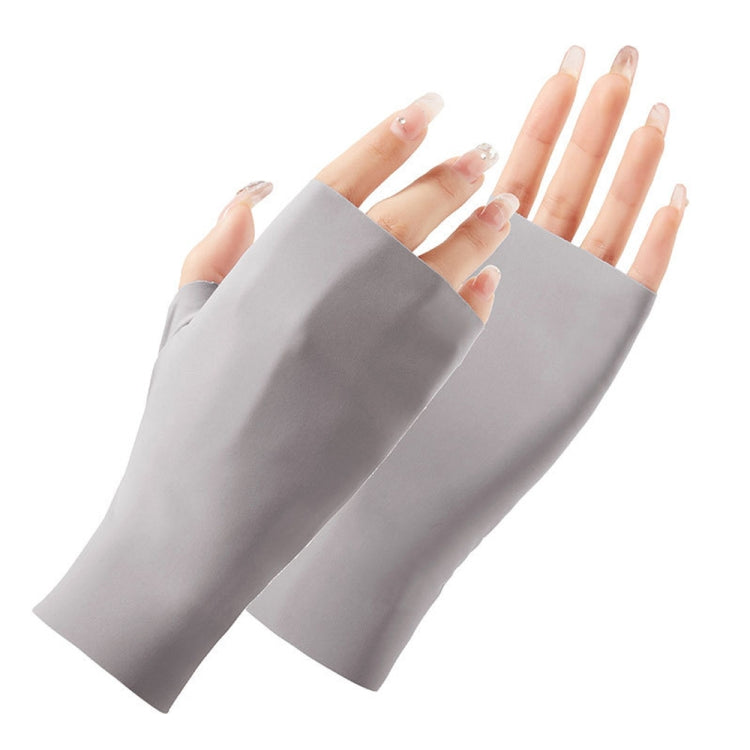 Light gray half-finger sunscreen gloves, open fingers, two hands wearing