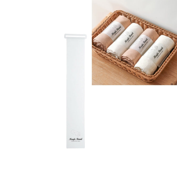 White self-adhesive roll strap with fastening clip, displayed upright