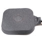 Black speckled nonstick four-hole pan with central round disc and side handle