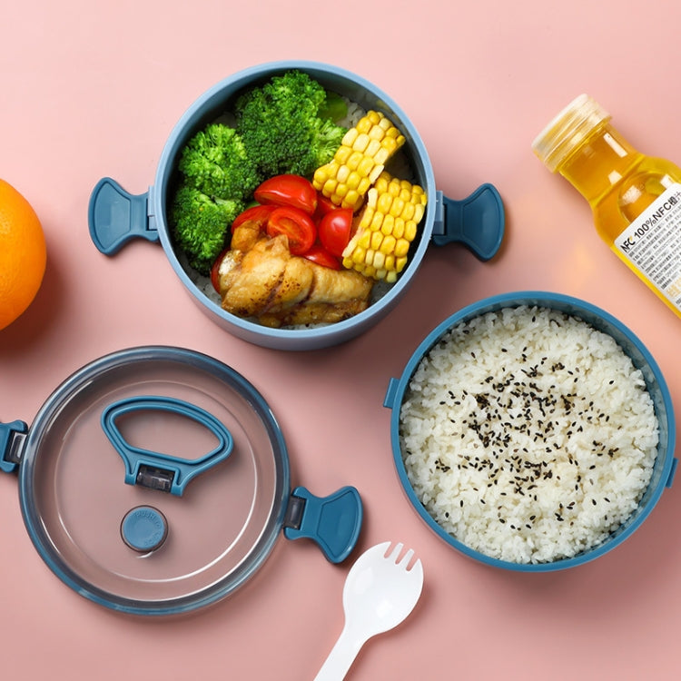Round insulated lunch box open with three food portions: rice, broccoli, and corn
