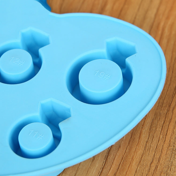 Blue silicone ice mold close-up with embossed cavity markings