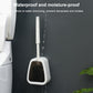 Wall-mounted toilet brush and base positioned against a surface, bristles upright