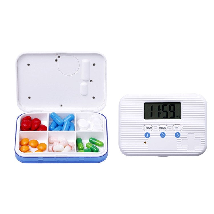 Mini electronic 6-compartment pill box, open with colored capsules and digital timer screen