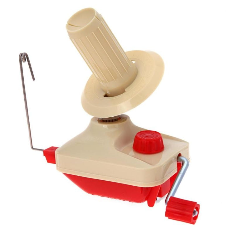 Handheld yarn winder with beige base, red control knob, and metal winding rod