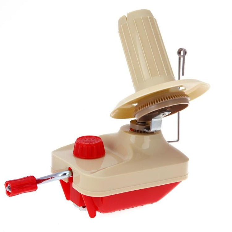 Yarn winder with beige top spool, metal crank lever, and red side handle