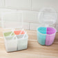 Square spice storage boxes with open lids, showing three pastel divider compartments