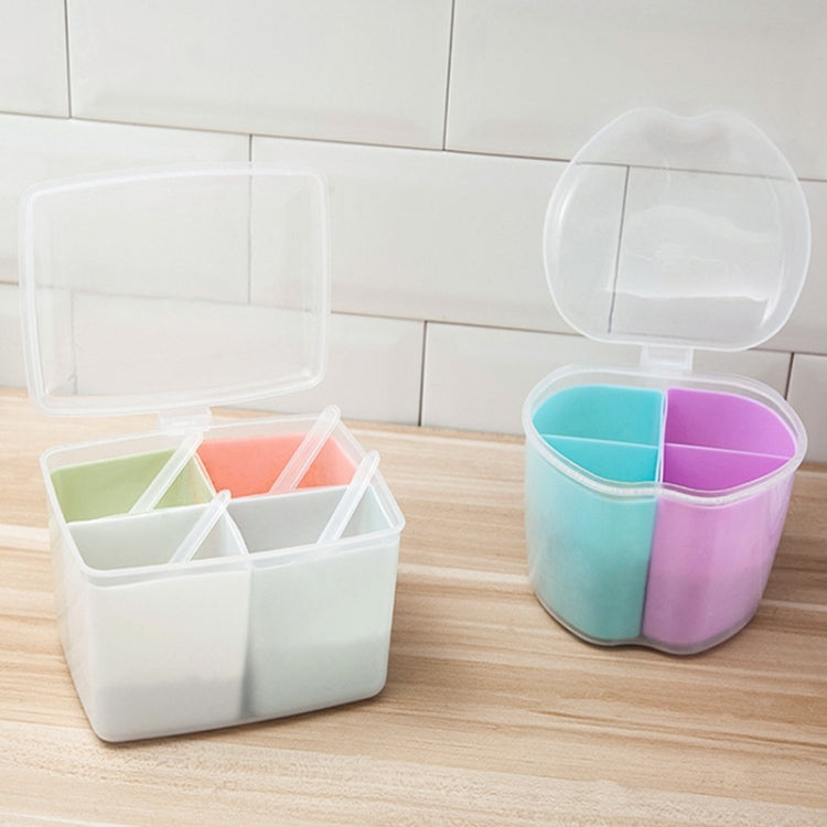 Square spice storage boxes with open lids, showing three pastel divider compartments