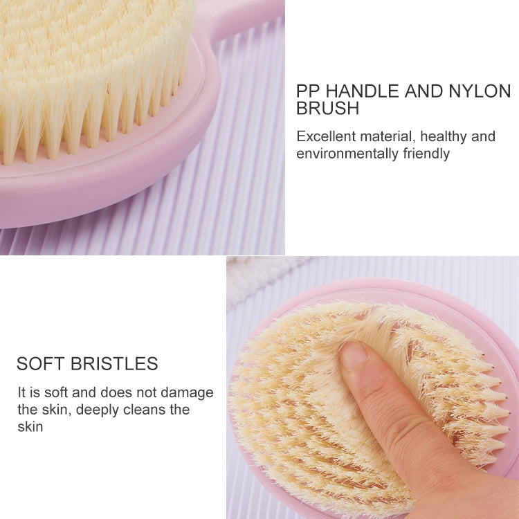 Pink bath brush head with soft yellow bristles, with hand pressing on circular pad