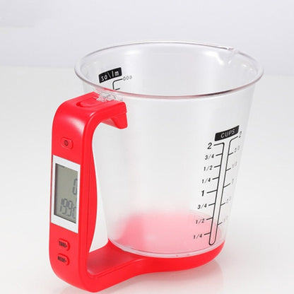 Red digital kitchen measuring cup scale with clear rim and cup fill markings