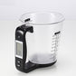 Black digital kitchen measuring cup scale with LCD screen and cup measurement markings