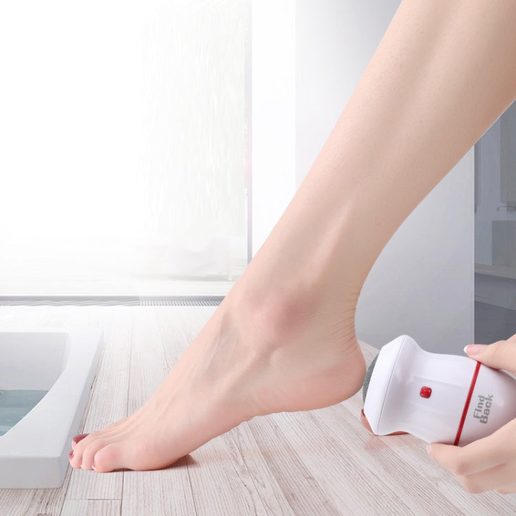 USB foot grinder held against a person’s foot for at-home pedicure
