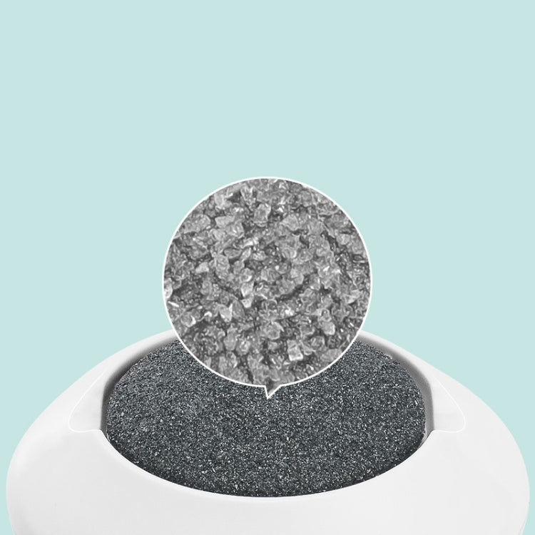 Textured dark grinding disc on a white foot grinder head