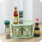 Green plastic seasoning rack with multiple cup compartments for spices