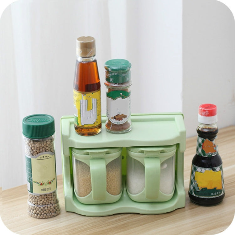 Green plastic seasoning rack with multiple cup compartments for spices