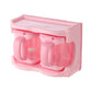 Pink plastic seasoning rack with curved cup compartments and clear lid