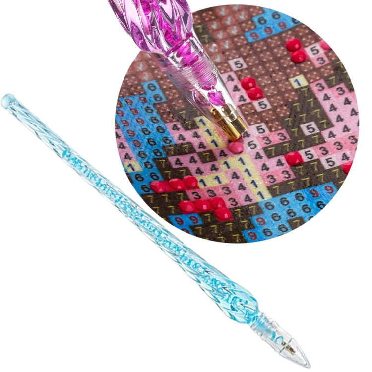 Blue glitter diamond painting pen with pointed tip over numbered canvas