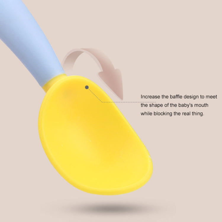 Baby learning yellow curved spoon with shallow scoop