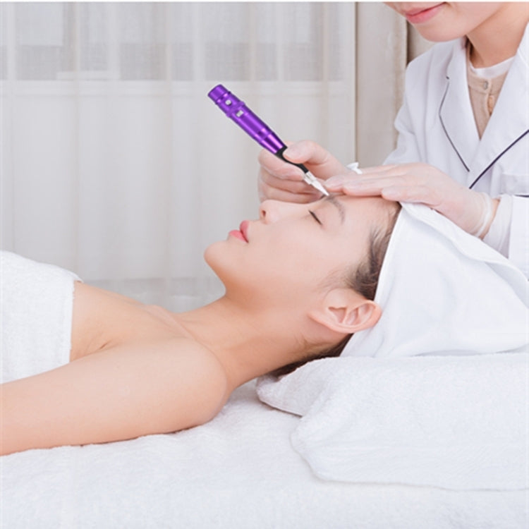 Purple semi-permanent tattoo pen used by a clinician during facial treatment