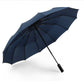 Navy automatic double-folding umbrella with black frame and strap handle