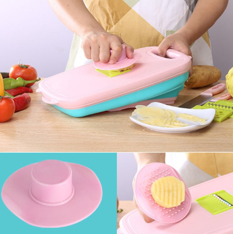 Folding plastic cutting board set with pink top and teal base, includes slicing inserts
