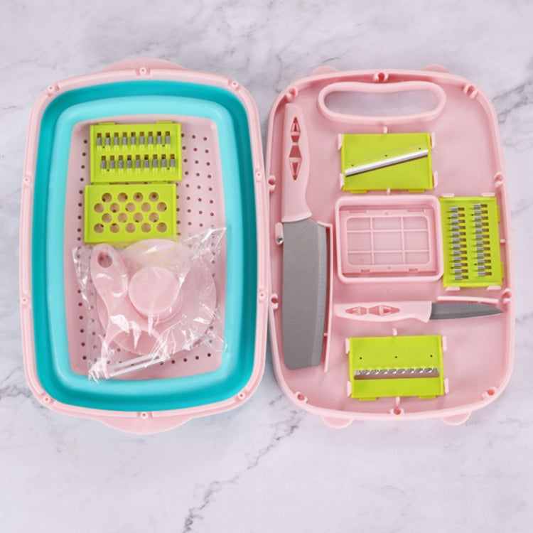 Folding plastic cutting board with perforated tray and blade attachments, teal and pink
