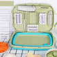 Folding plastic cutting board set with green tray and teal base, storage for inserts