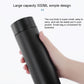 Black vacuum flask with smart temperature display, held in hand
