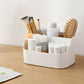 White plastic desk storage bin with divided compartments for toiletries and tools