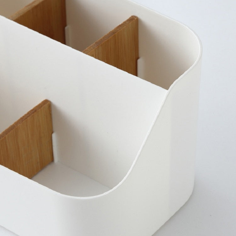 White plastic multi-compartment storage box with curved open dividers