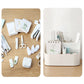 White plastic multi-compartment storage box holding stationery and small accessories