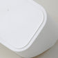 Close-up of white plastic storage box rounded rim and edge