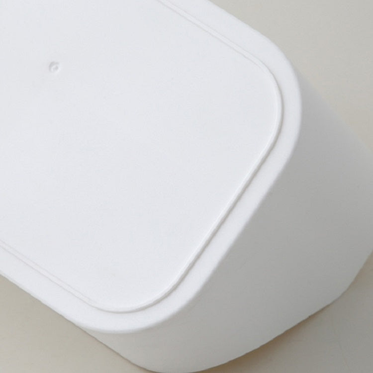 Close-up of white plastic storage box rounded rim and edge