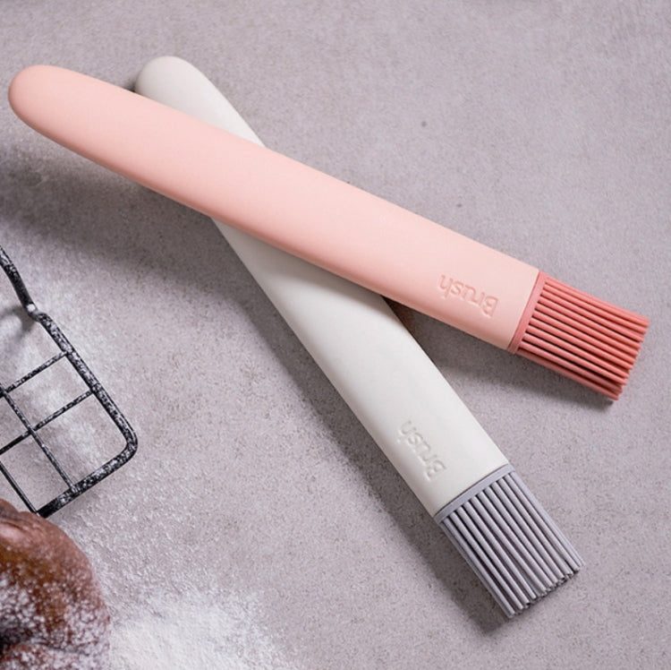 Removable silicone oil brush with pink handle and gray bristles