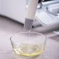 Silicone oil brush dripping oil from the bristle head