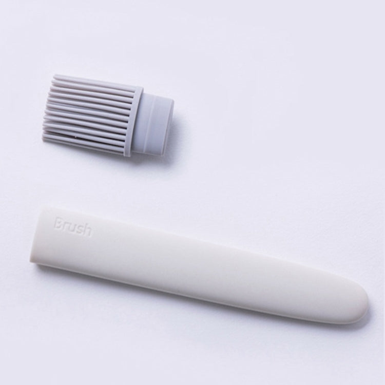 Silicone oil brush with detachable bristle cap and handle