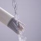 Silicone bristle head releasing clear oil while brushing