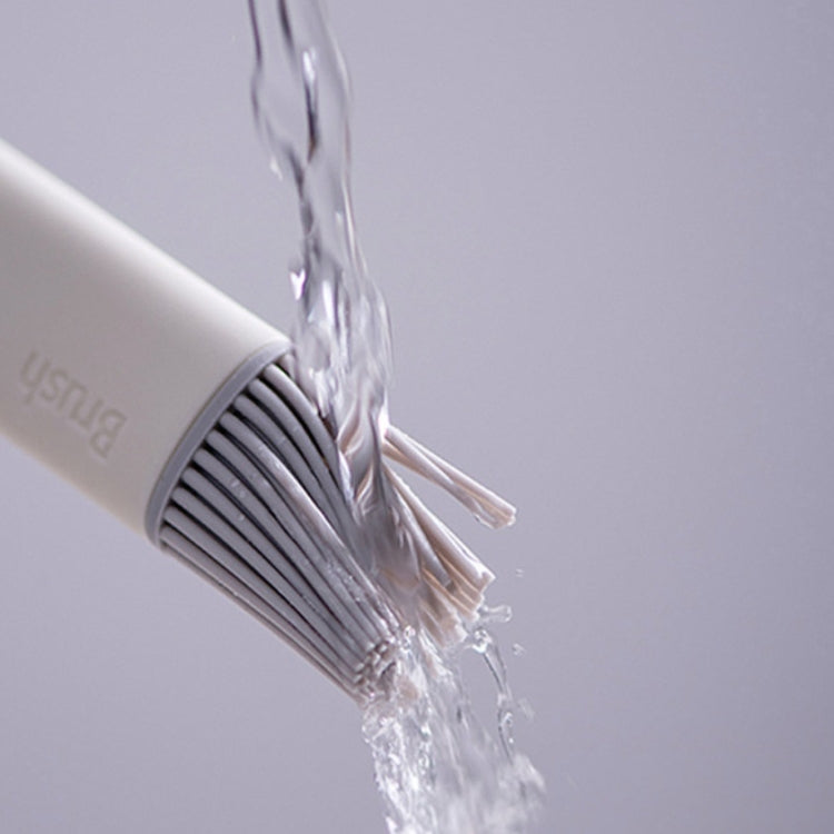 Silicone bristle head releasing clear oil while brushing